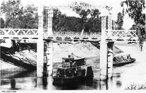 P.S. William Davies towing barge under Wilcannia bridge • Photograph • State Library of South ...