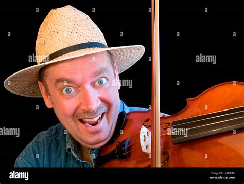 A man is playing country music on the fiddle Stock Photo - Alamy