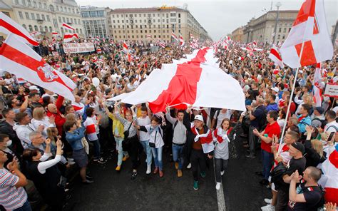 Videos show Belarus president armed with rifle as massive protests roil capital | The Times of ...