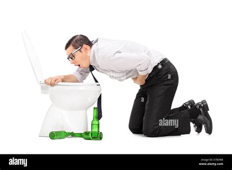 Drunk man throwing up in a toilet isolated on white background Stock Photo - Alamy