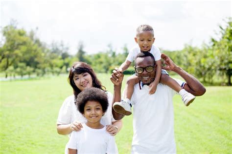 Happy Diverse and Mixed Race Family Group Photo in the Park Stock Photo ...