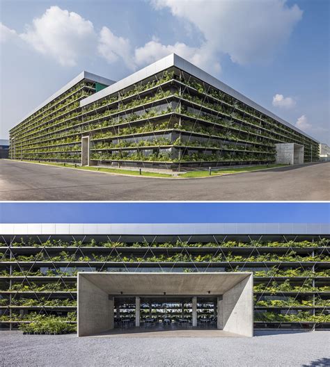 Rows Of Plants Line The Exterior Of This Factory Building