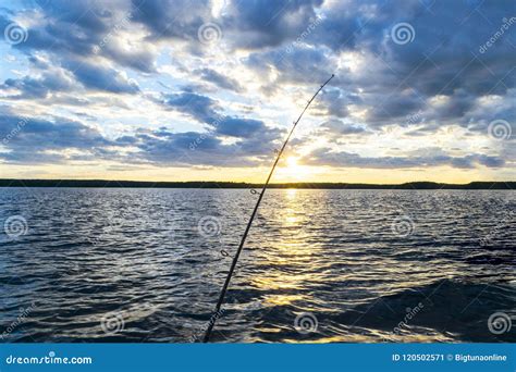 Fishing Road Silhouette during Sunset. Fishing Pole Against Ocean at Sunset Stock Image - Image ...