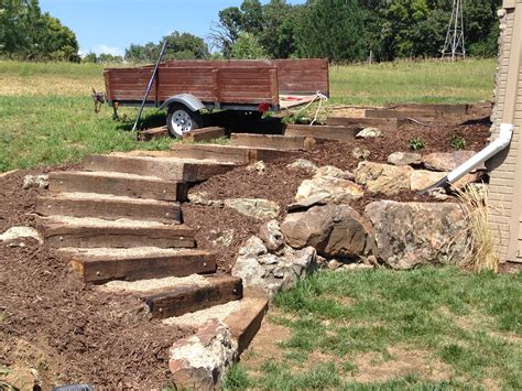 Railroad tie timber steps filled with pea gravel. (Outdoor, exterior, landscaping, stairs ...