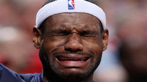 Raptors fans wear photos of Crying LeBron meme on their faces