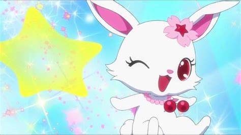 a white rabbit with pink ears and a star in the background