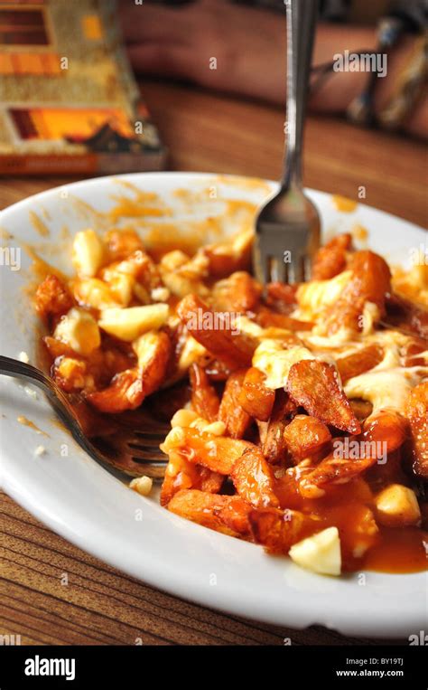 A dish of poutine, a popular Canadian food Stock Photo - Alamy