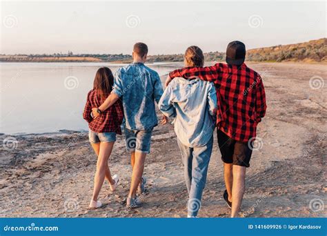 Friends on Beach Together Walking during Sunset Stock Photo - Image of friends, lake: 141609926