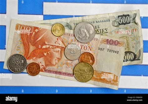 Drachma Greek currency on the flag of Greece Stock Photo - Alamy