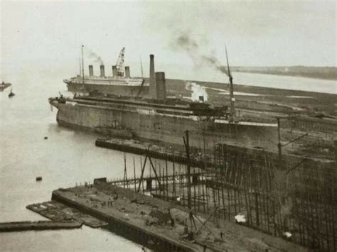 October 1911, Titanic under construction while Olympic returns to Belfast for repairs after her ...