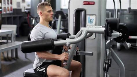 Machine Lateral Raise Guide: How To, Muscles Worked, and Variations