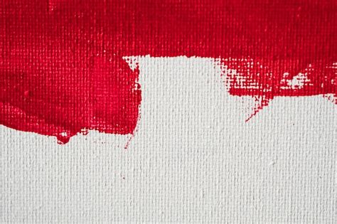 Premium Photo | Close up texture red color paint on white canvas background