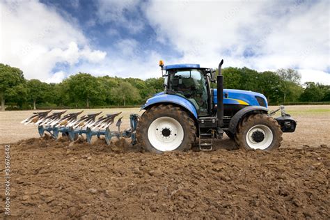 Tractor Ploughing Field Stock Photo | Adobe Stock