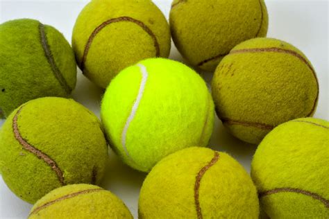 Brand new tennis ball among eight used ones | Brand new tenn… | Flickr