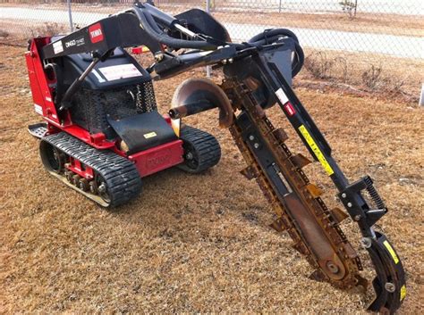 a red and black ski - doon sitting on the ground