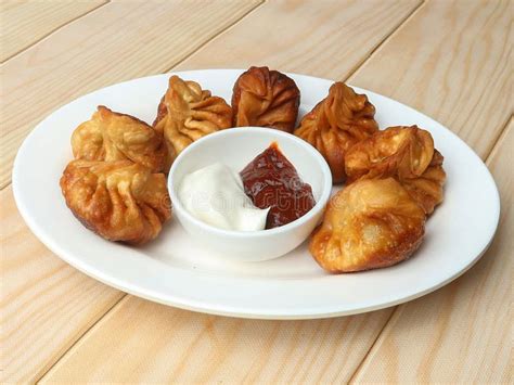 Veg Fried Momo with Sauce Served Over a Rustic Wooden Background ...