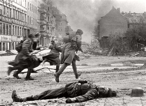 Red Army Soldiers Run Past the Body of a Dead German Soldier During the ...