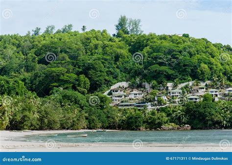 VICTORIA, SEYCHELLES - MAY 15, 2013: Beach in Seychelles with Buildings in Background Editorial ...