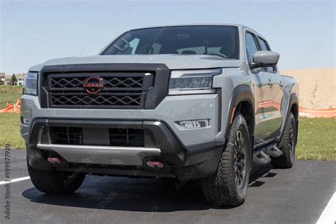 Nissan Frontier pickup truck display at a dealership. Nissan offers the ...