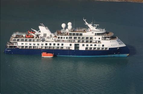 Grounded Expedition Cruise Ship Remains Stuck in Remote Greenland Fjord