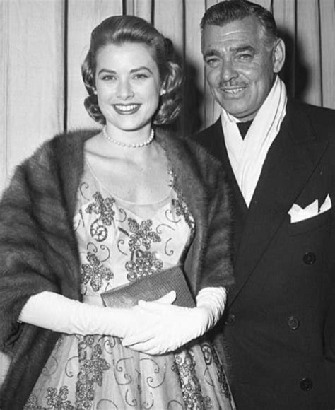 Grace Kelly and Clark Gable photographed at the 26th Academy Awards held in RKO Pantages Theatre ...