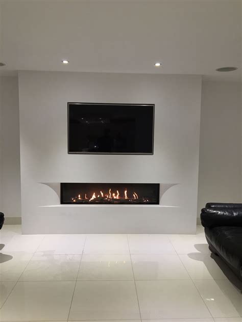 Tulp balanced flue gas fire with the superb undercover shaped fascia set in a false chimn ...