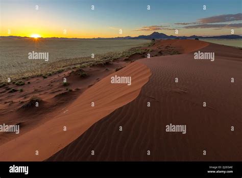 Sunrise at sand dune in the Namib Desert Namibia Stock Photo - Alamy