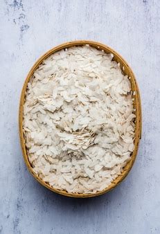 Premium Photo | Raw flattened rice or thick or thin rice flakes for ...