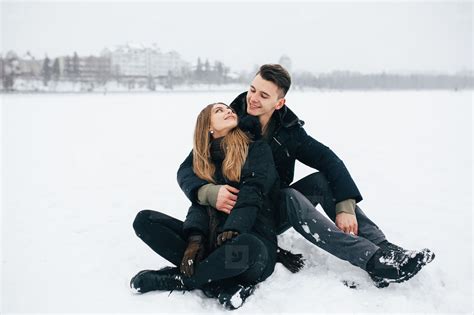 couple sitting on the snow stock photo (189002) - YouWorkForThem