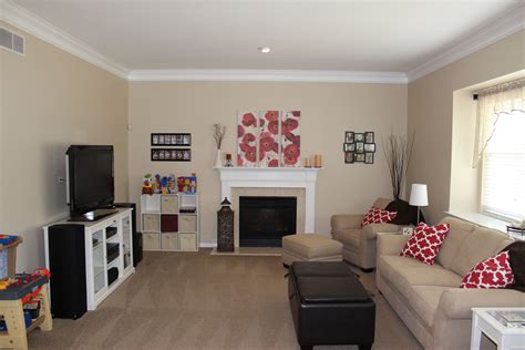 My own family room! :-) Sherwin Williams Softer Tan. I love it with the red accents. | Paint ...