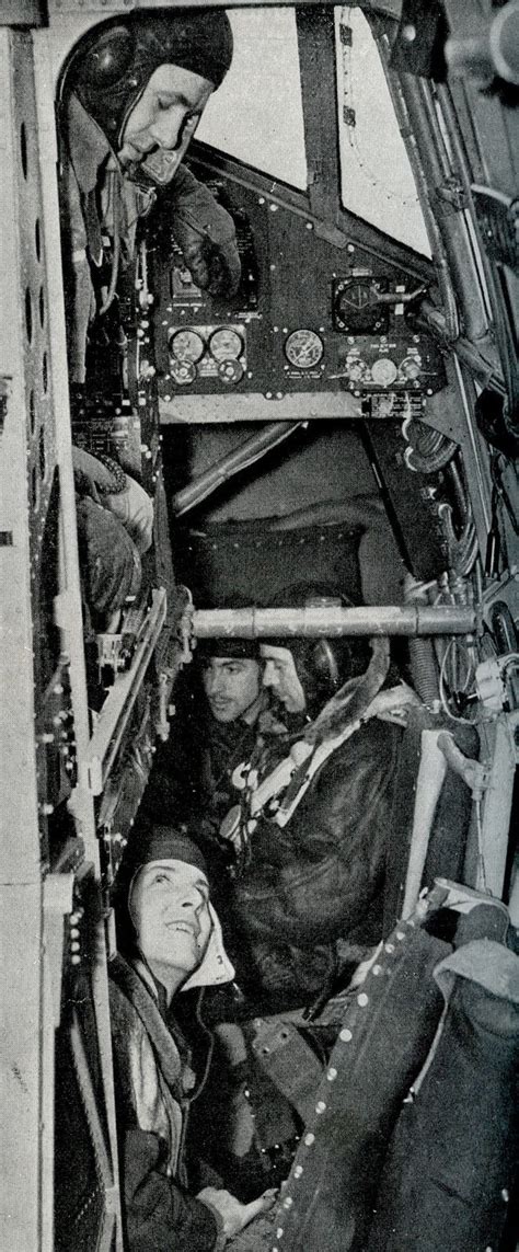 Halifax Bomber Crew. The pilot looks down at the radio operator. Forward are the bombardier ...