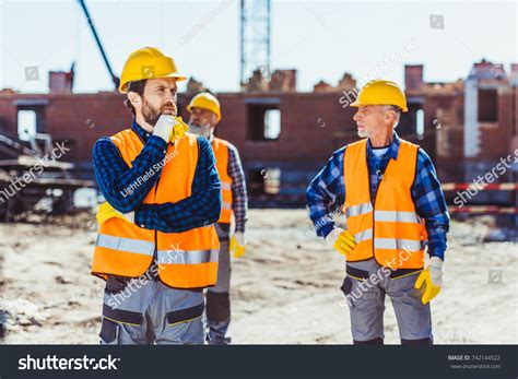 Стоковая фотография 742144522: Construction Workers Uniform Standing ...