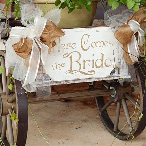 A wagon displaying "here comes the bride" was out for guests to know ...