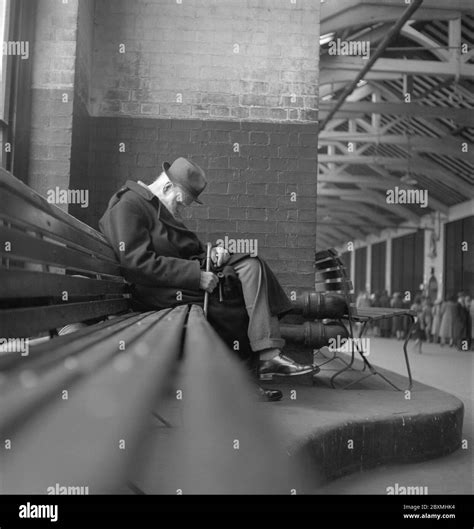 Old man sleeping on bench Black and White Stock Photos & Images - Alamy