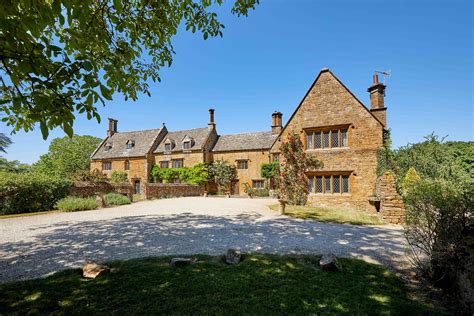 A Cotswolds manor house that boasts a pool, tennis court and six ...