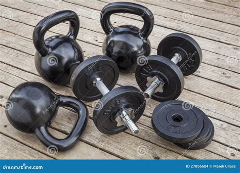 Kettlebells and dumbbells stock photo. Image of weight - 27856684