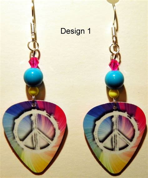 the peace sign is hanging from the earrings