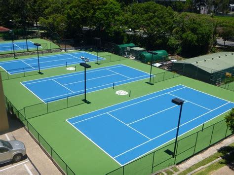 This whole tennis court area looks really nice. The light blue color of ...