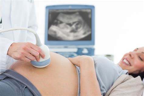 Pregnant woman undergoing ultrasound – MRI Scan & Imaging Center