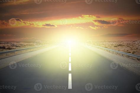 Empty road on a desert with sunset sky 21573481 Stock Photo at Vecteezy