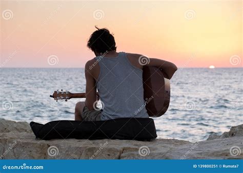 The Guitar Player on Tel-Aviv Beach at Sunset Editorial Photo - Image ...