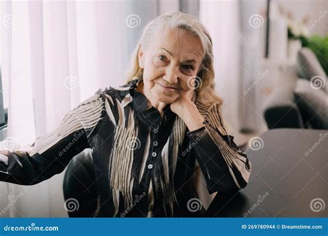 Smiling Portrait of Happy Senior Woman Smiling and Sitting on Sofa at Home Stock Photo - Image ...