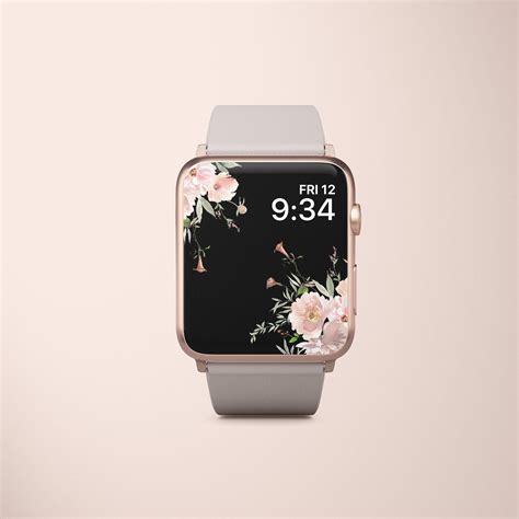 an apple watch with floral print on the screen and white band, against a light pink background