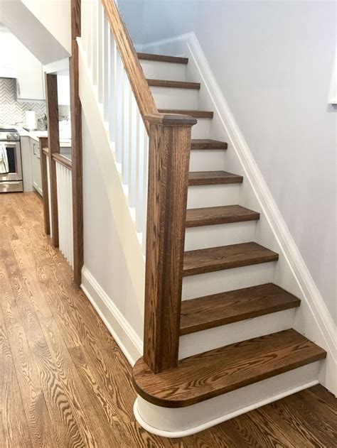 Oak stairs with provincial stain and white risers. #basementstairsrailing | Stained staircase ...