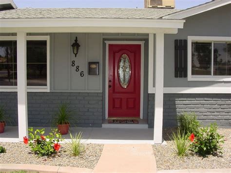 gray house black shutters red door - Carmelia Sheehan