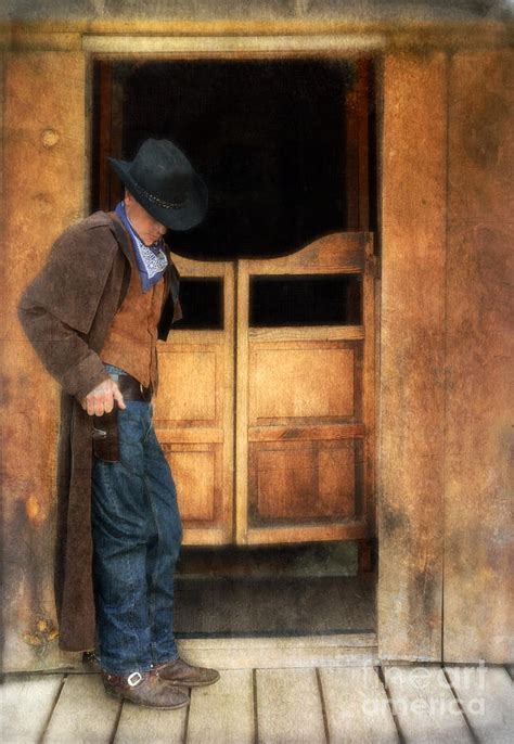 Cowboy by Saloon Doors Photograph by Jill Battaglia - Pixels