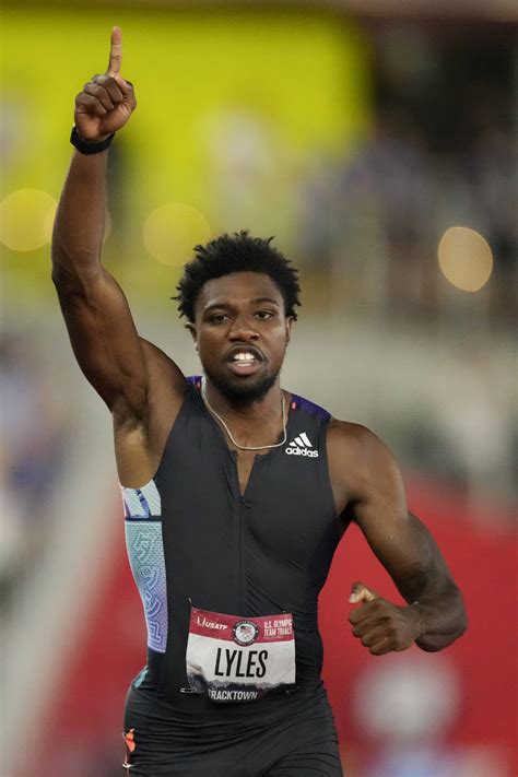 Noah Lyles celebrates after winning the final in the men’s 200-meter run at the U.S. Olympic Tr