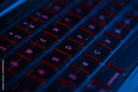 laptop keyboard neon blue and red light Stock Photo | Adobe Stock