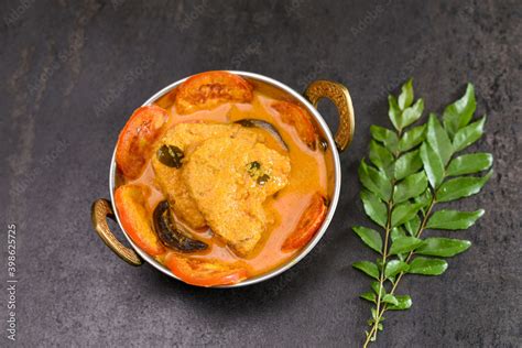 Kerala fish curry coconut milk gravy , cooking spicy Goan fish curry ...