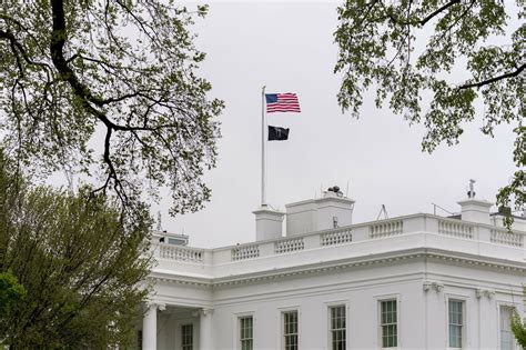 Biden returns prisoner-of-war flag to perch atop White House | AP News